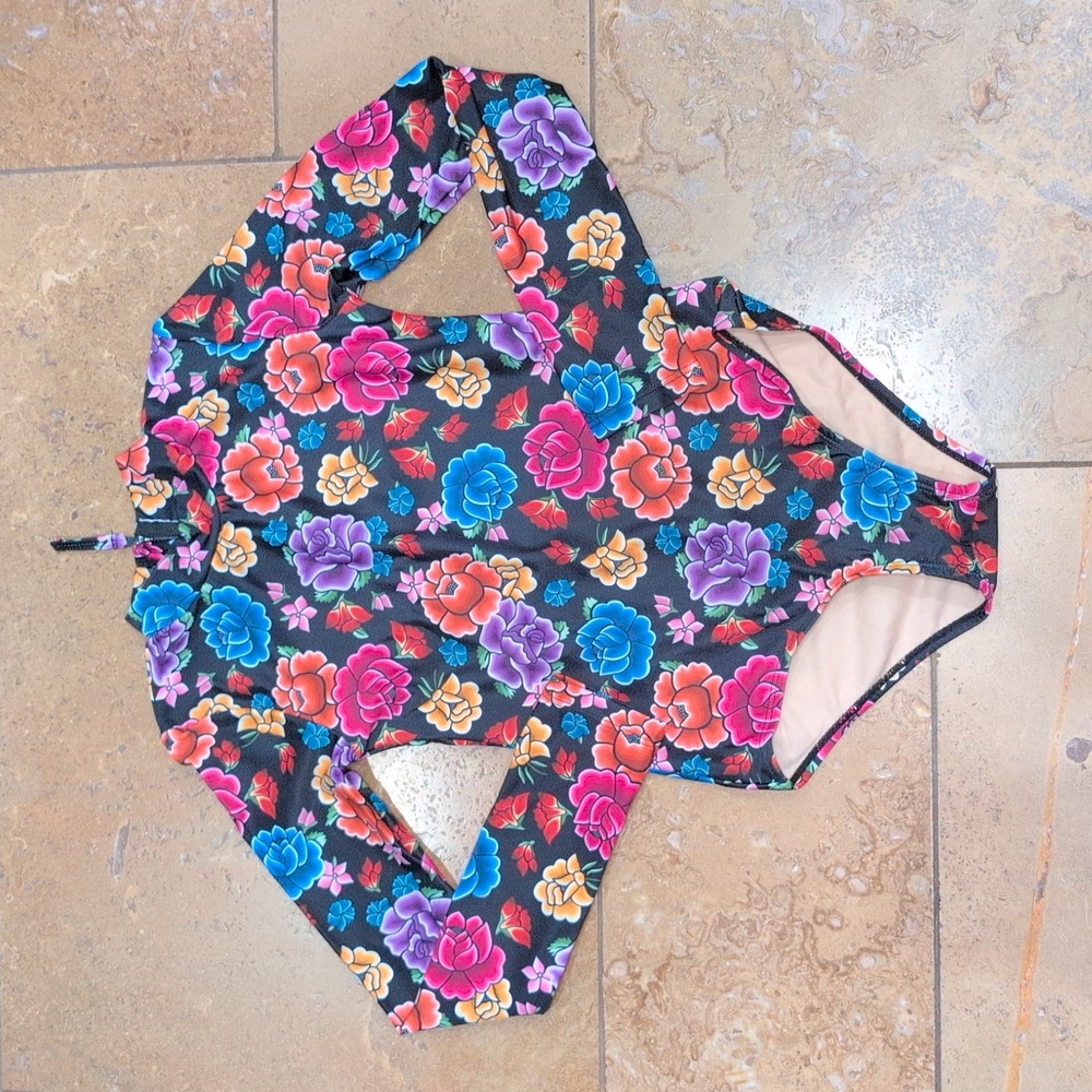 Mott50 girl one piece rash guard. Black and pink floral. Size 10.